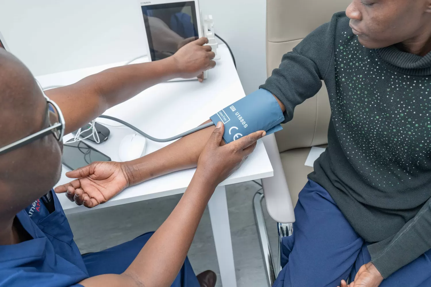 Blood pressure check during a cardiology assessment at AmeriHealth Africa