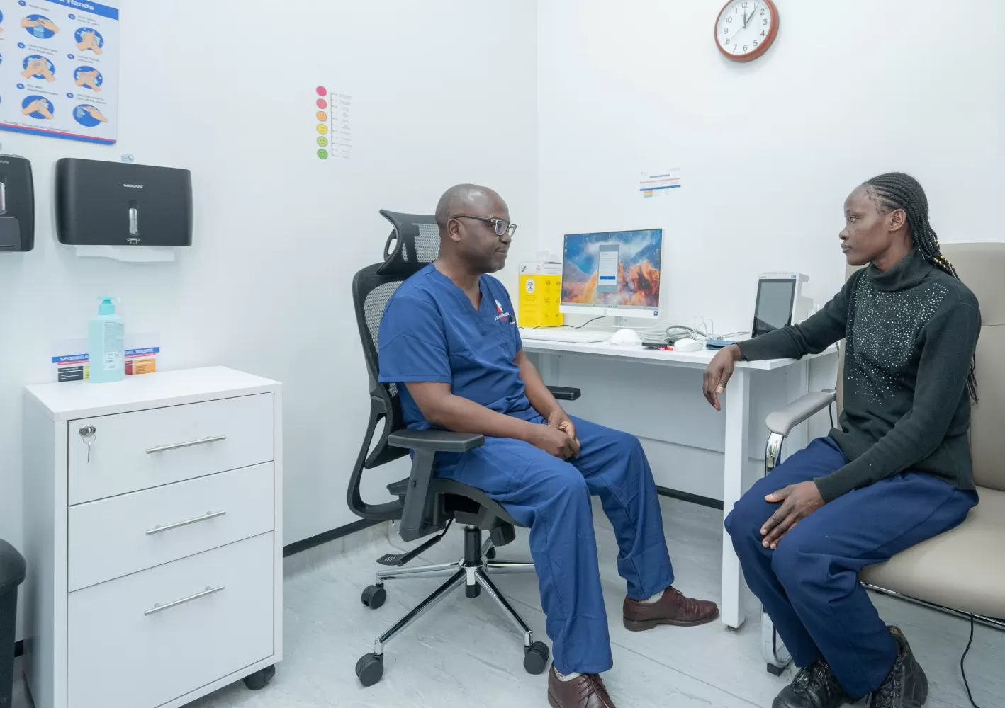 Doctor consulting a patient at AmeriHealth Africa, Westlands
